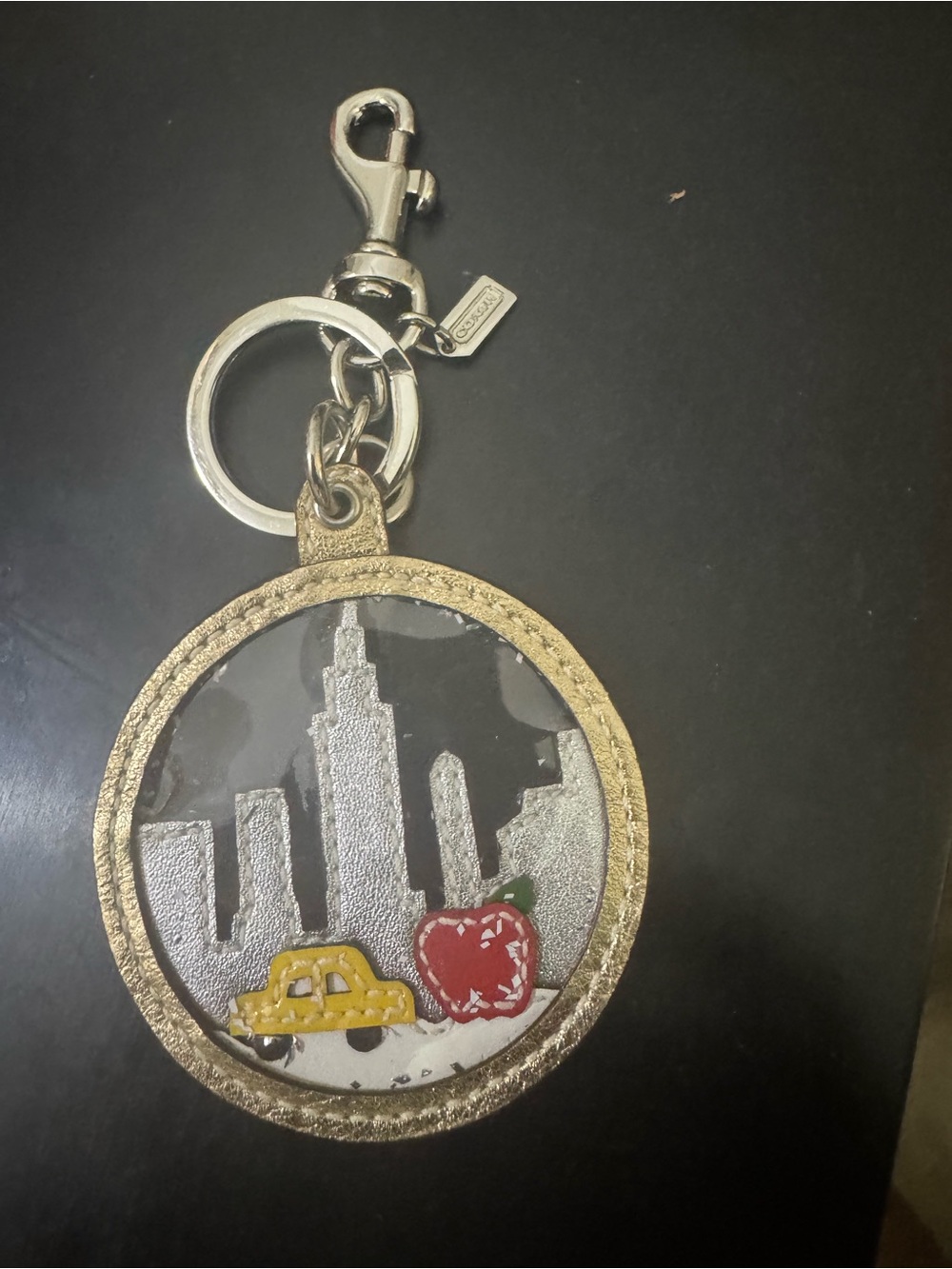 Coach Gold-Tone NY City Skyline Keychain Charm with Yellow Taxi and Red Apple